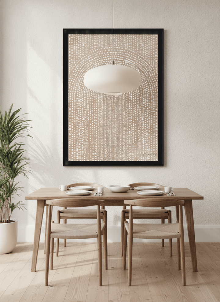 Wall art styled above a dining table in a contemporary home