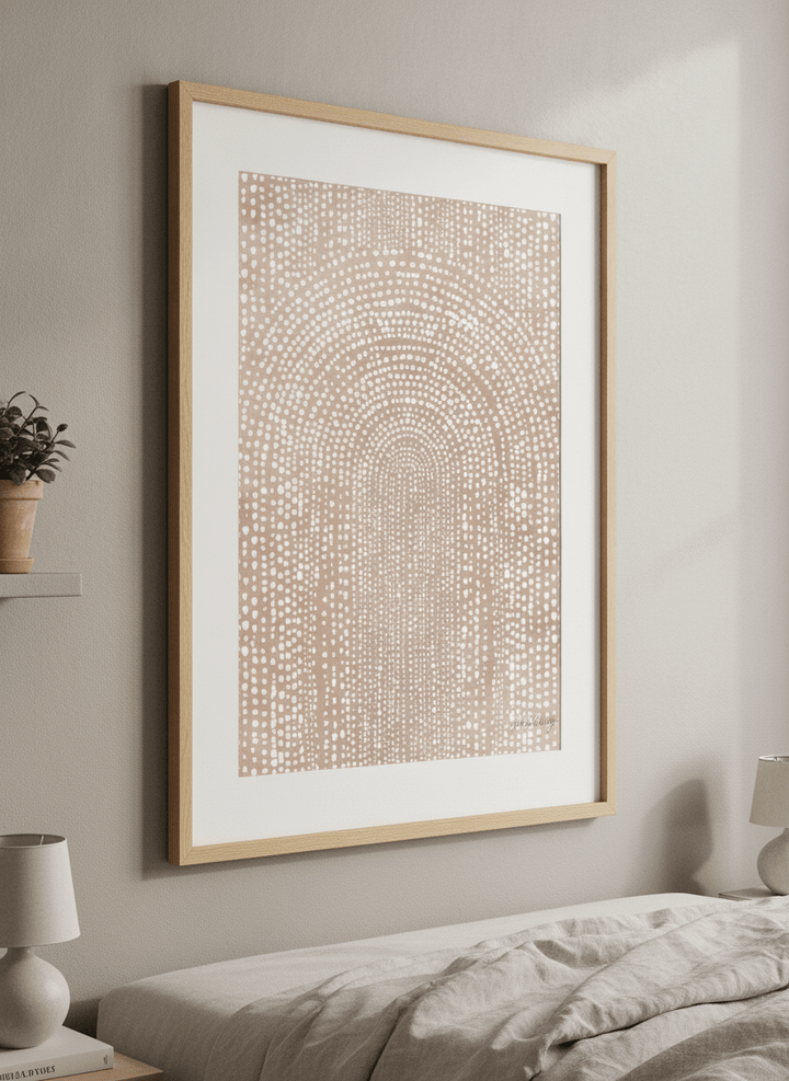 Minimalist artwork displayed in a calm, light-filled bedroom interior
