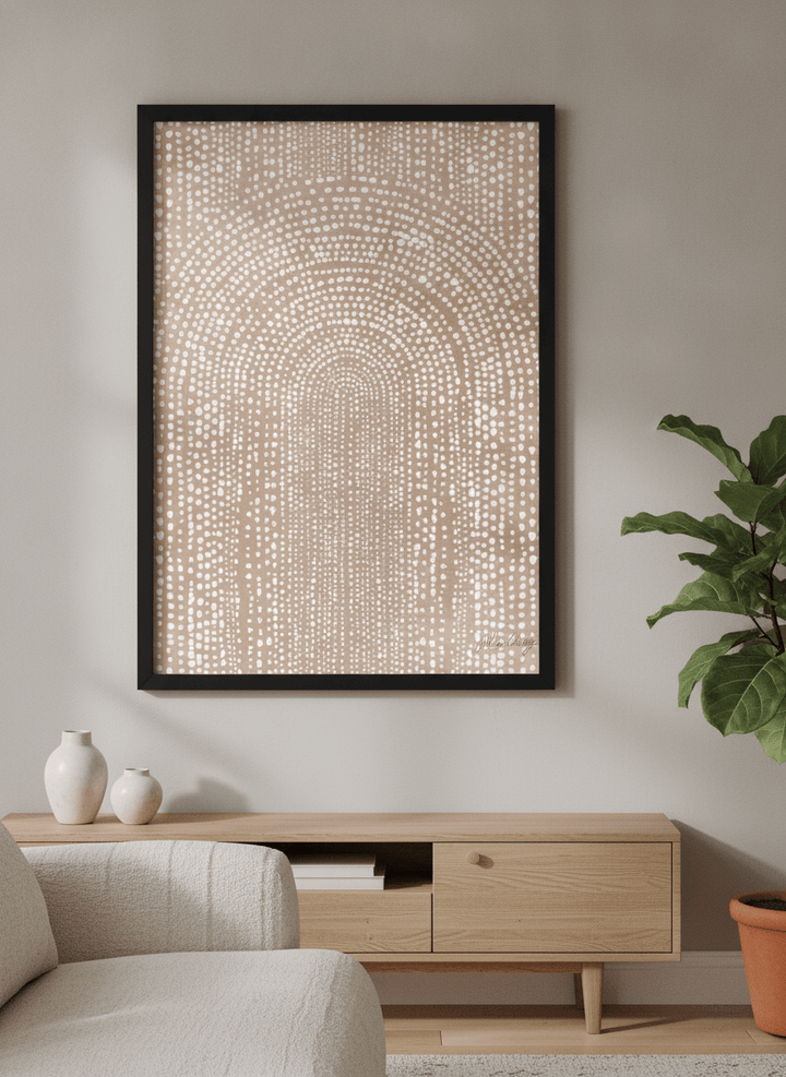 Modern wall art styled above a sofa in a neutral living room