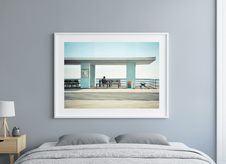 Minimalist artwork displayed in a calm, light-filled bedroom interior