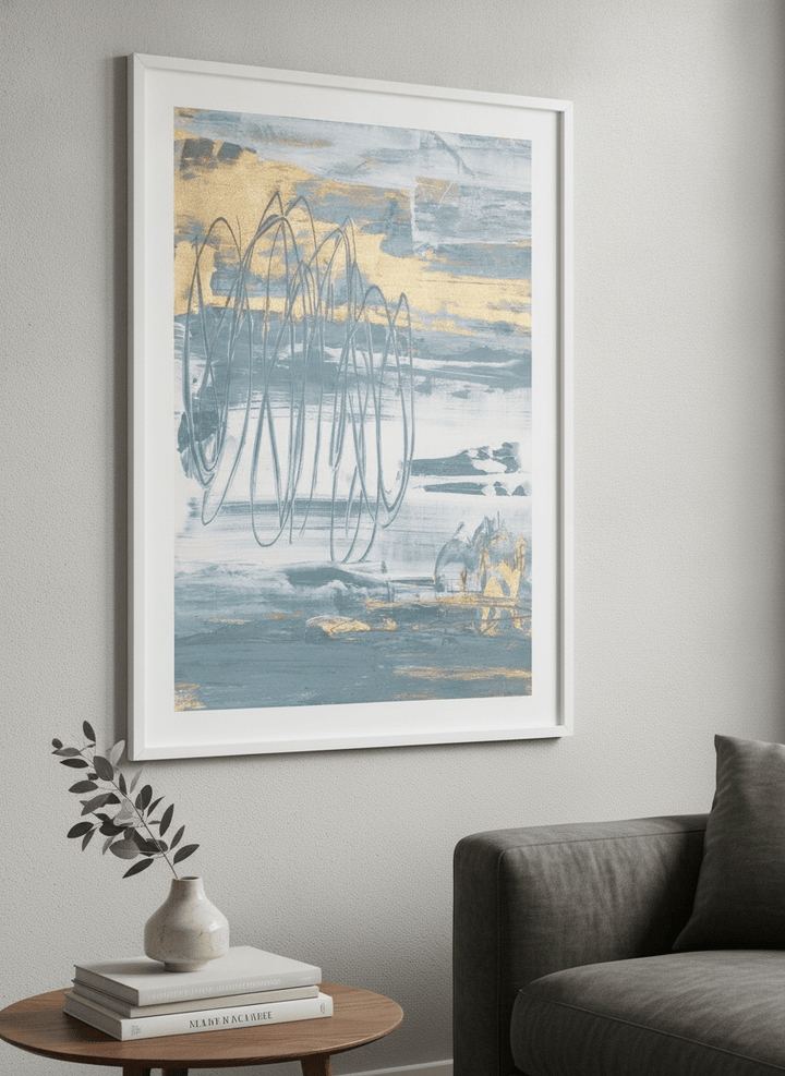 Modern wall art styled above a sofa in a neutral living room