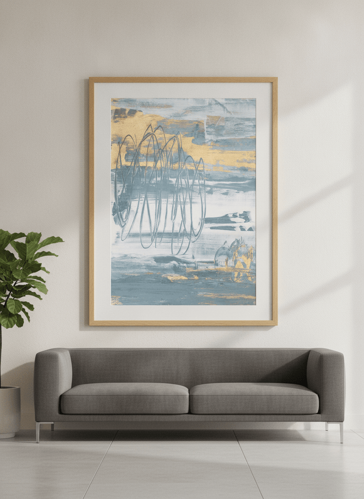 Modern wall art styled above a sofa in a neutral living room