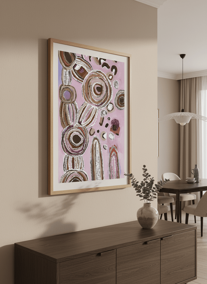 Wall art styled above a dining table in a contemporary home