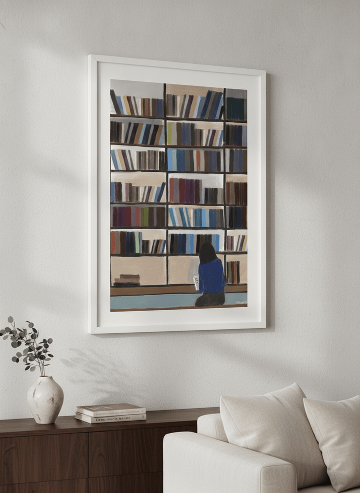 Modern wall art styled above a sofa in a neutral living room