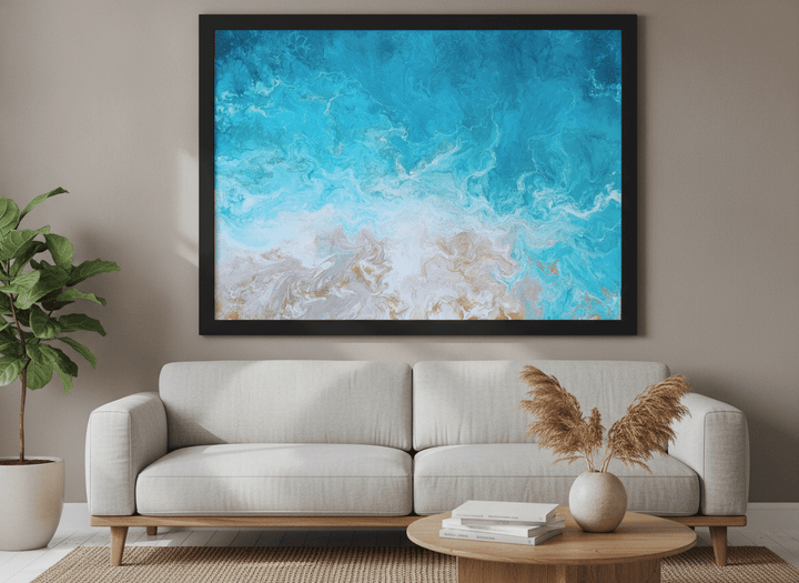 Modern wall art styled above a sofa in a neutral living room