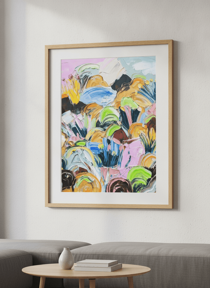 Modern wall art styled above a sofa in a neutral living room