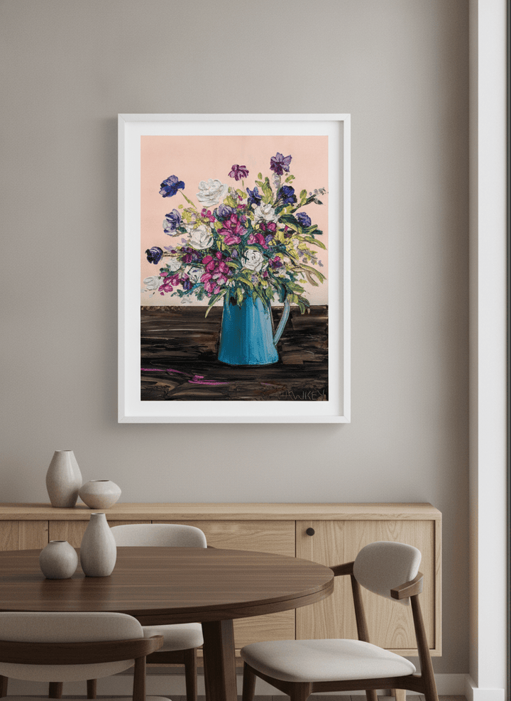 Wall art styled above a dining table in a contemporary home