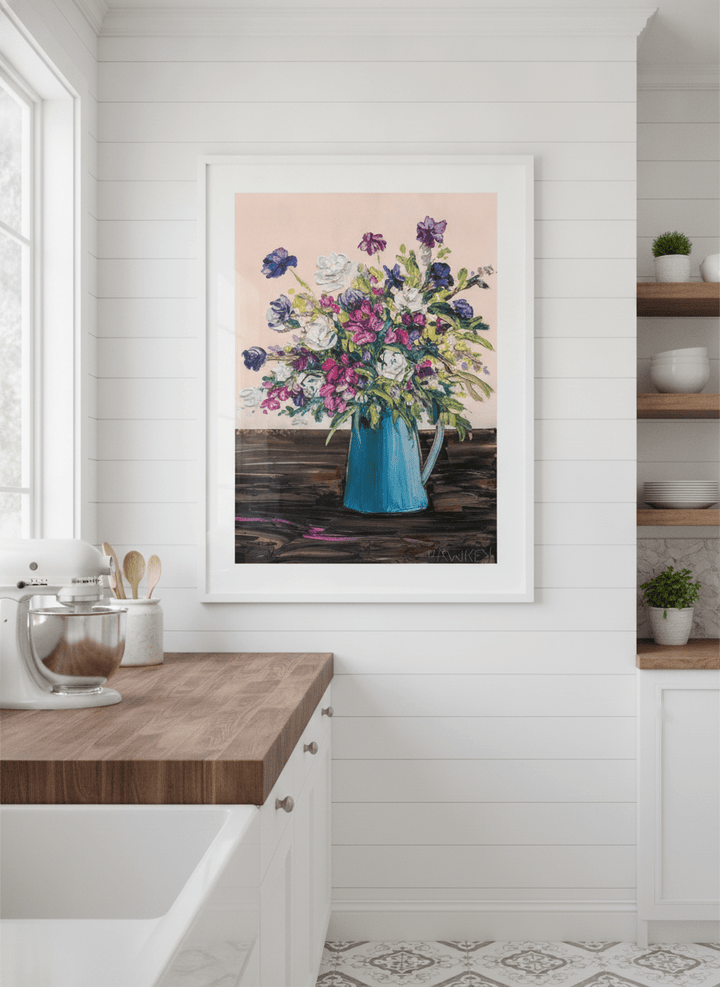 Artwork styled on the wall of a bright modern kitchen
