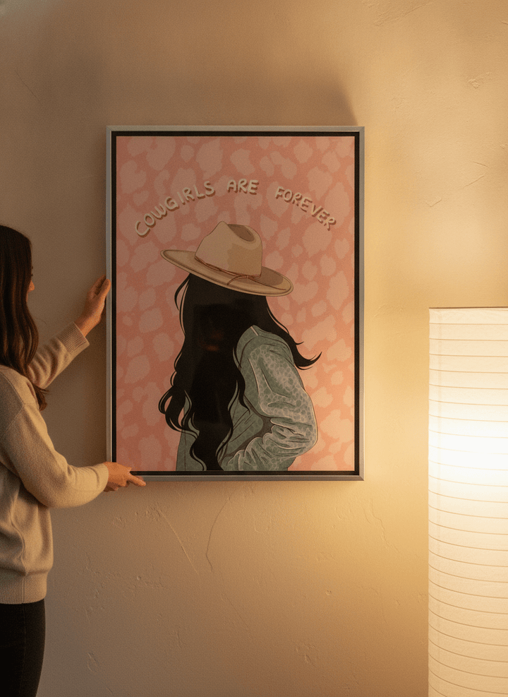 Person holding canvas wall art with a silver leaf surround in a warm Japandi living room
