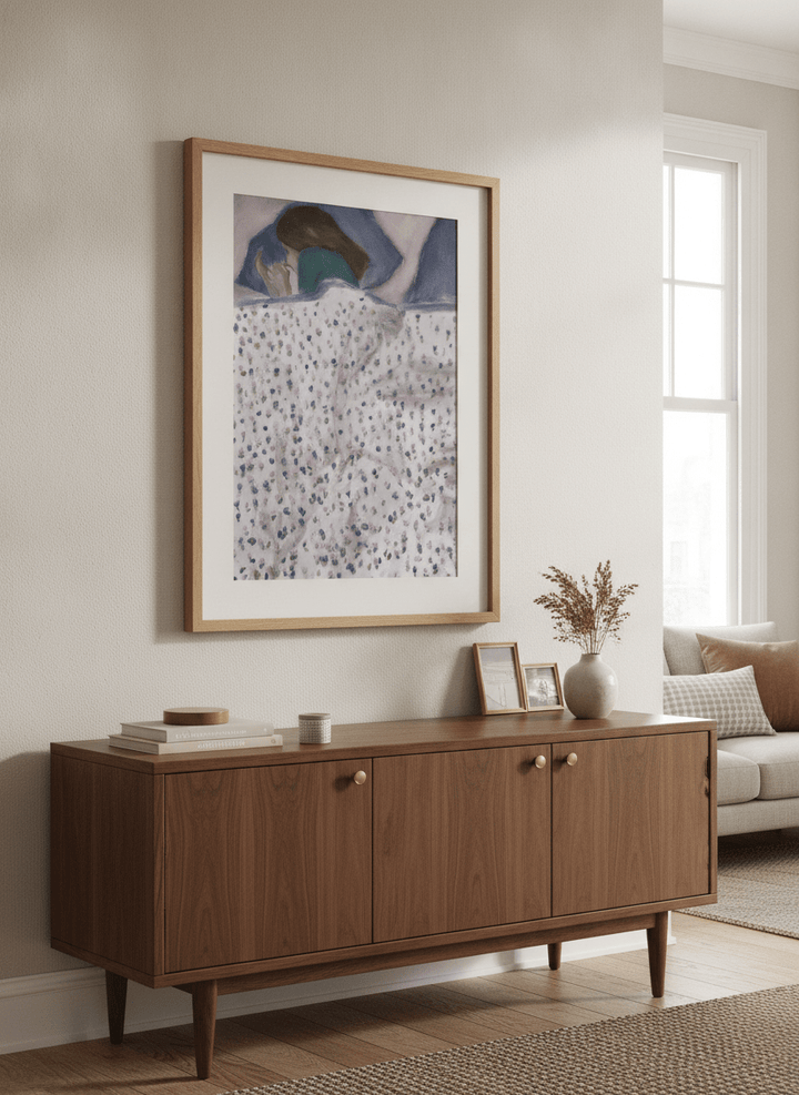 Artwork displayed above a credenza in a real-looking contemporary home