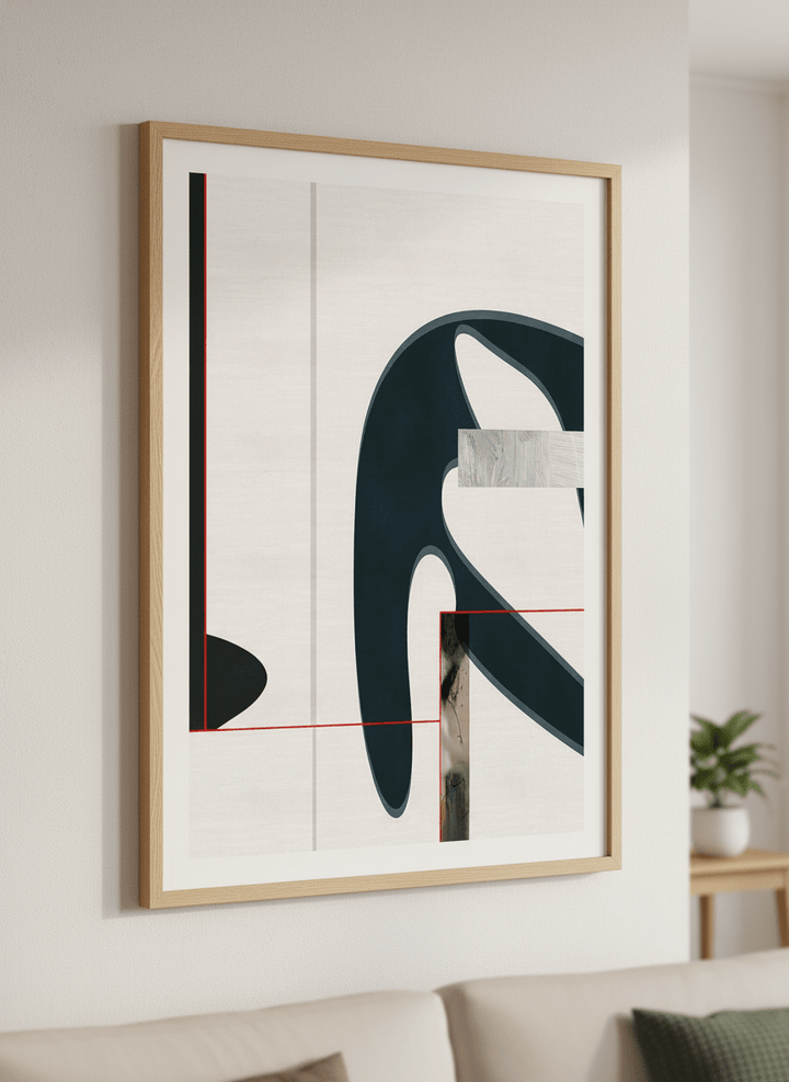 Modern wall art styled above a sofa in a neutral living room