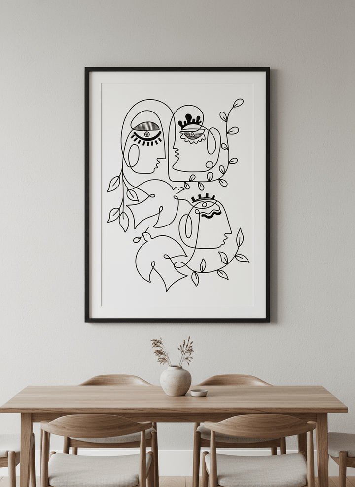 Wall art styled above a dining table in a contemporary home