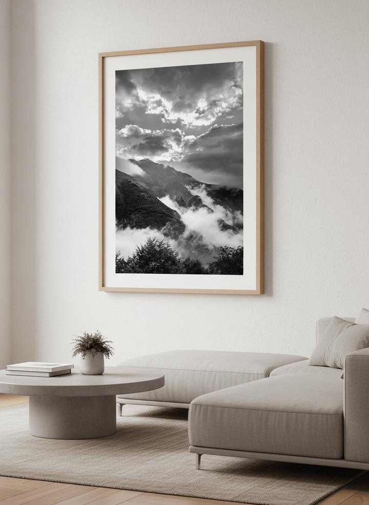 Modern wall art styled above a sofa in a neutral living room