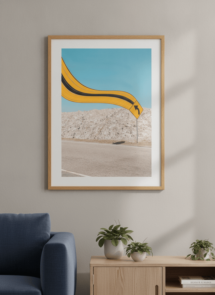 Modern wall art styled above a sofa in a neutral living room