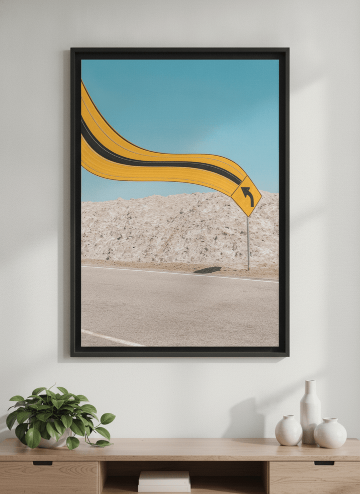 Modern wall art styled above a sofa in a neutral living room