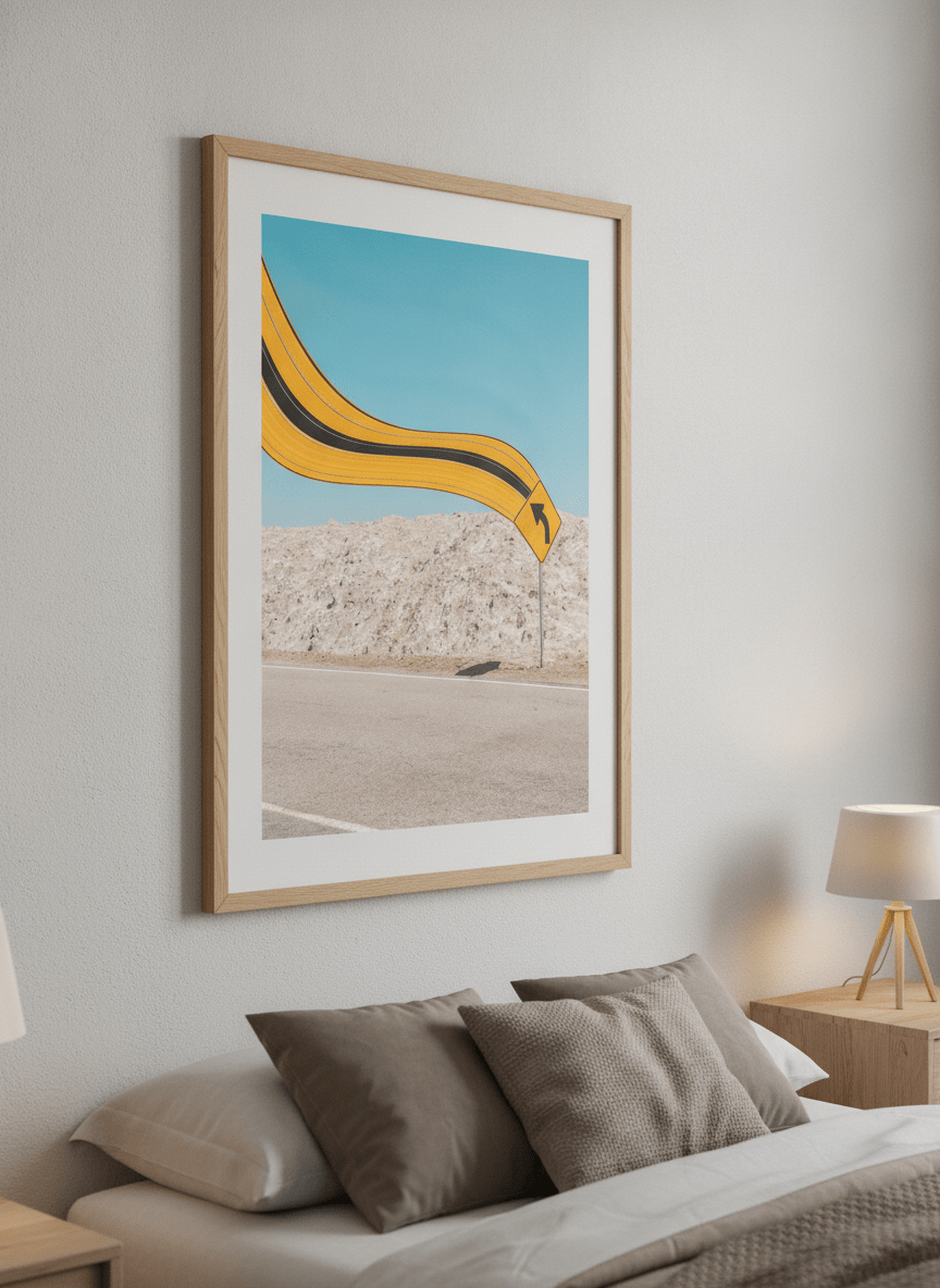 Minimalist artwork displayed in a calm, light-filled bedroom interior
