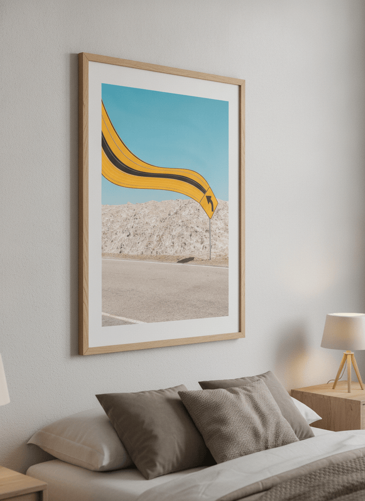Minimalist artwork displayed in a calm, light-filled bedroom interior