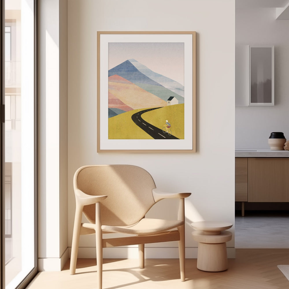 Modern interior with a beige armchair, small table, and abstract landscape art on a white wall.