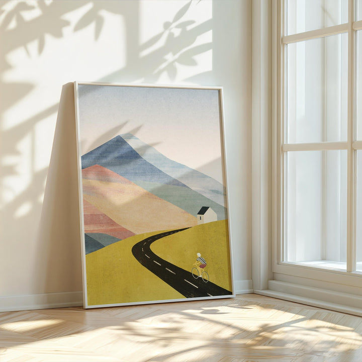 Abstract landscape art on a wall with sunlight casting shadows.