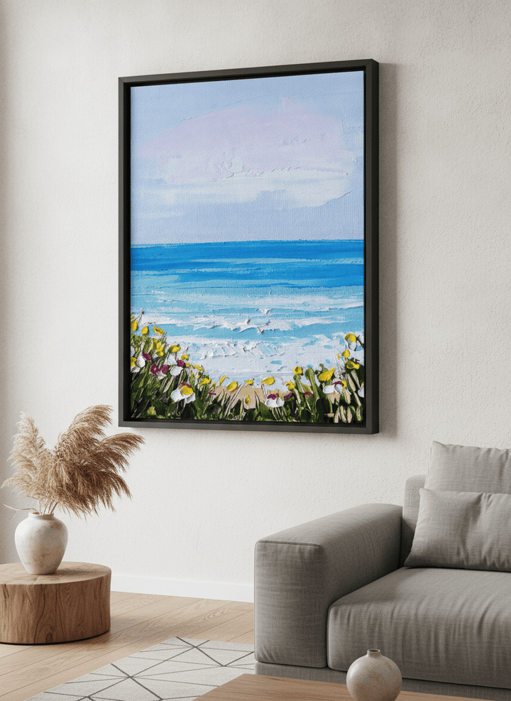 Modern wall art styled above a sofa in a neutral living room