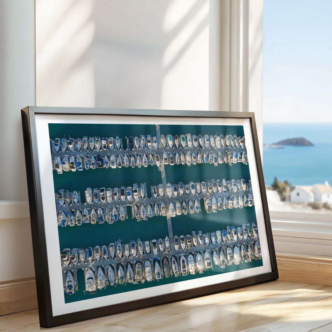 Photo with a blue background and white text, placed on a surface with a window view of water and buildings.