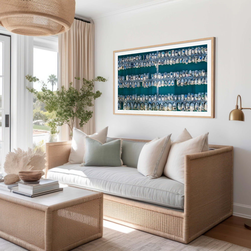 photo of a marina with rows of boats docked along parallel piers hanged on wall of a coastal living room