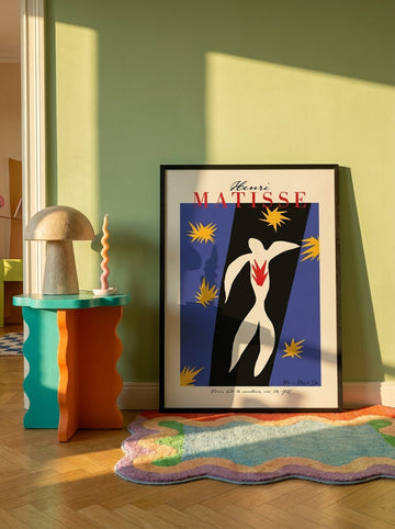 Modern wall art print leaning against the wall in a colourful eclectic dining room