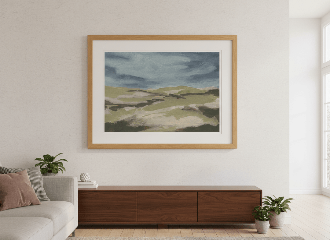 Modern wall art styled above a sofa in a neutral living room