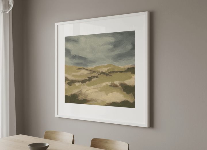 Wall art styled above a dining table in a contemporary home