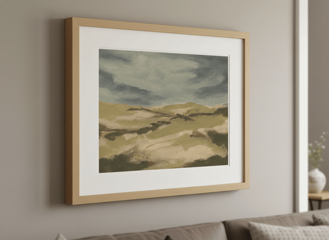 Modern wall art styled above a sofa in a neutral living room