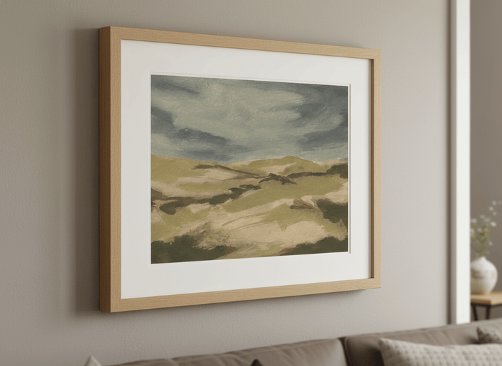 Modern wall art styled above a sofa in a neutral living room