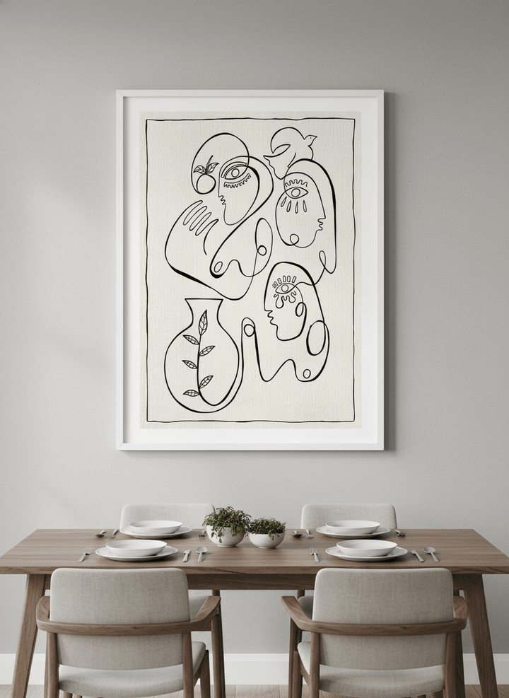 Wall art styled above a dining table in a contemporary home
