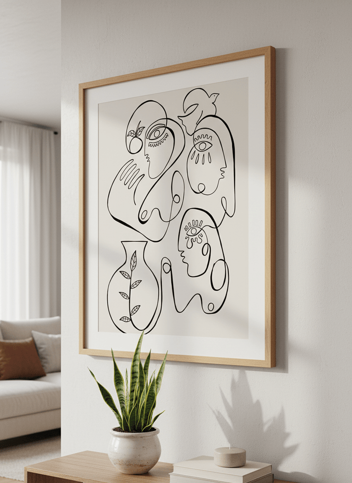 Modern wall art styled above a sofa in a neutral living room