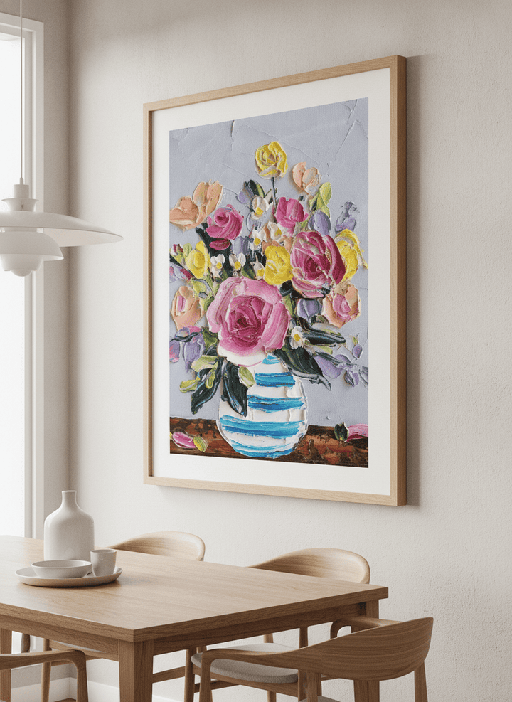Wall art styled above a dining table in a contemporary home
