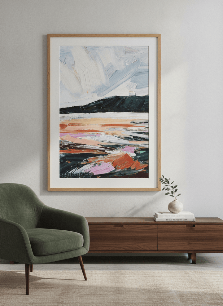 Modern wall art styled above a sofa in a neutral living room