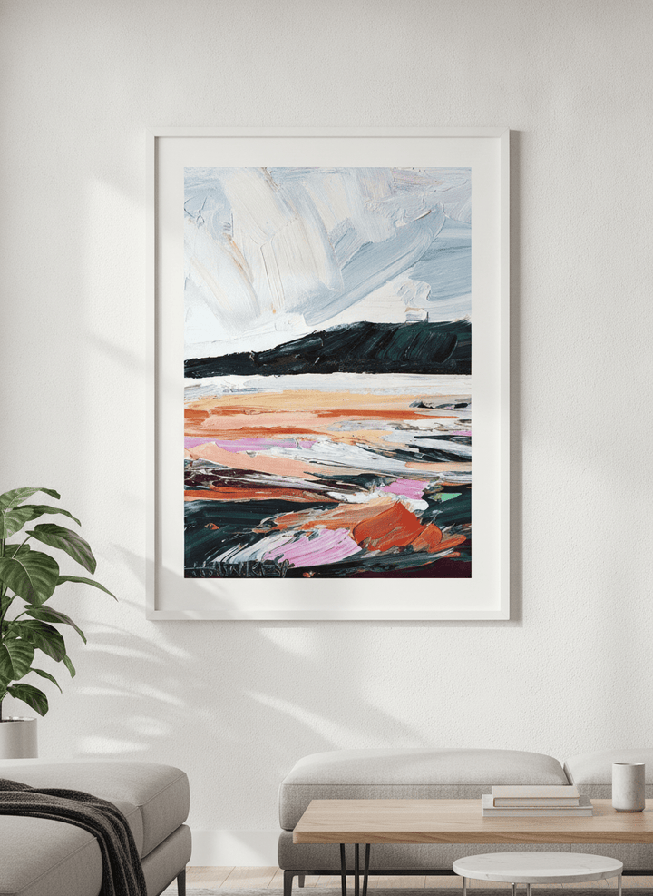 Modern wall art styled above a sofa in a neutral living room