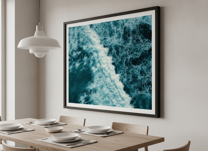 Wall art styled above a dining table in a contemporary home