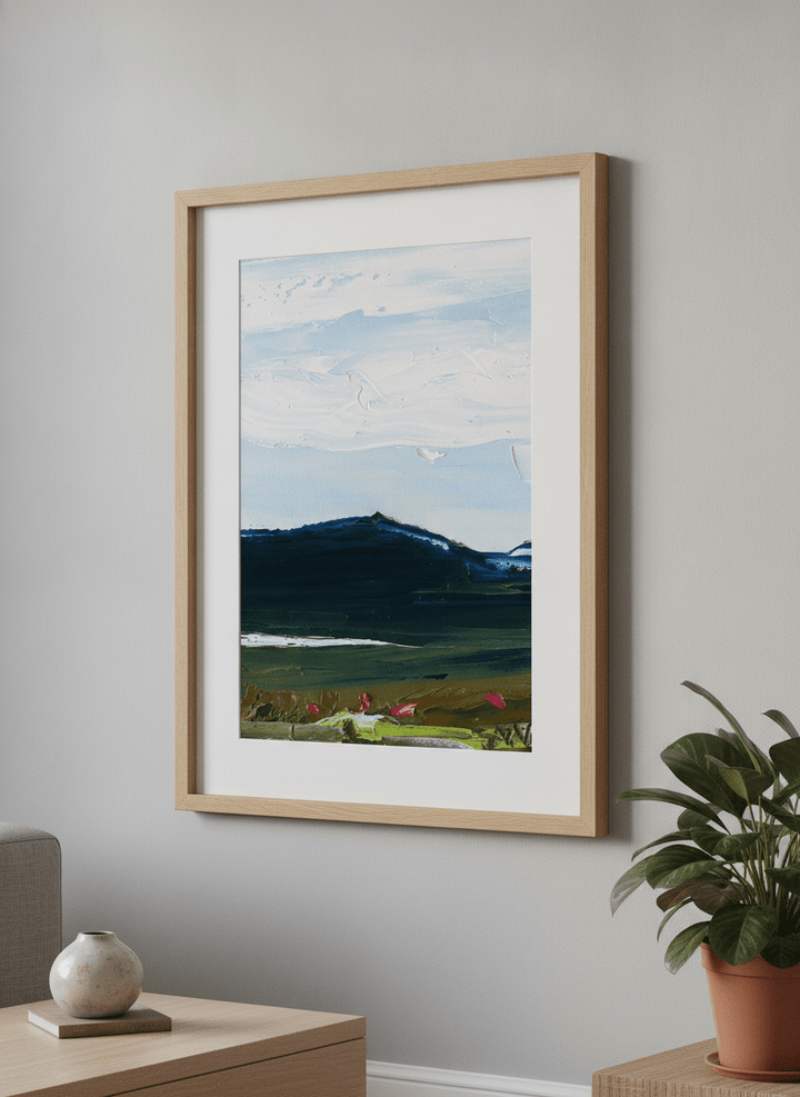 Modern wall art styled above a sofa in a neutral living room