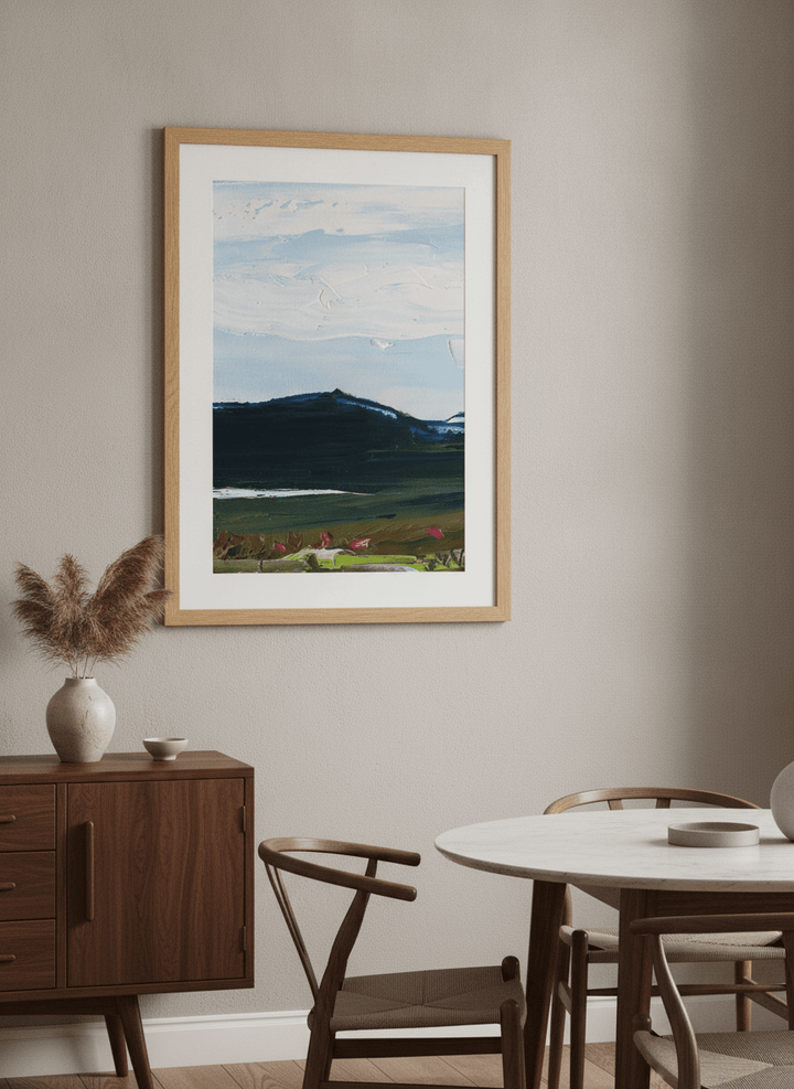 Wall art styled above a dining table in a contemporary home