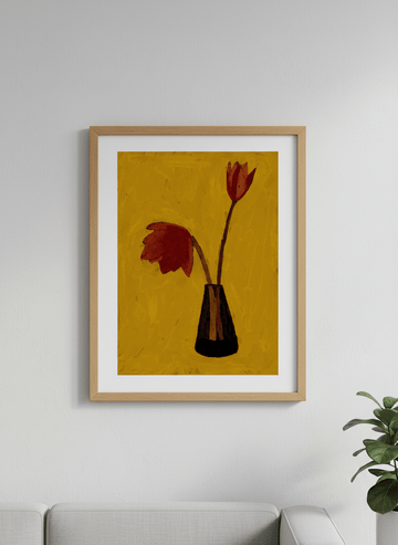Modern wall art styled above a sofa in a neutral living room