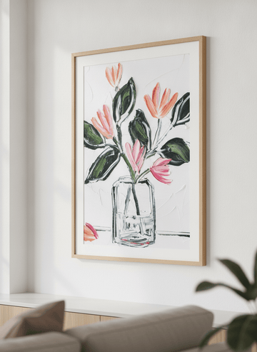 Modern wall art styled above a sofa in a neutral living room