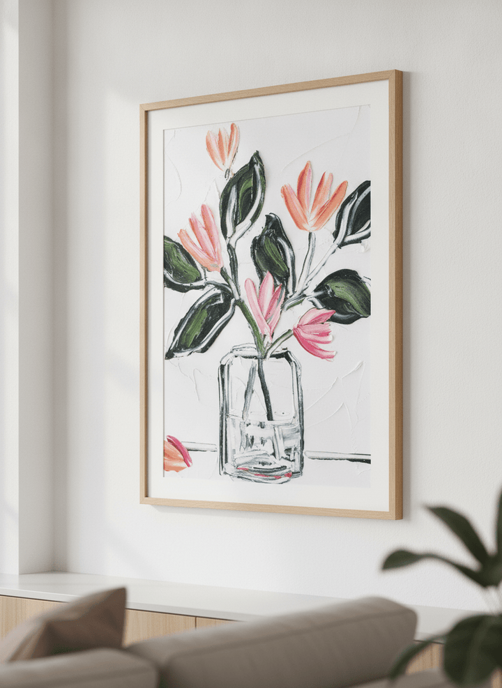 Modern wall art styled above a sofa in a neutral living room