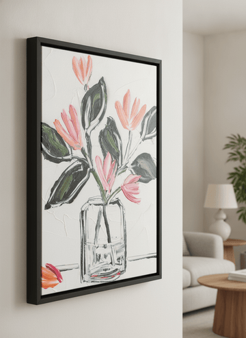 Modern wall art styled above a sofa in a neutral living room