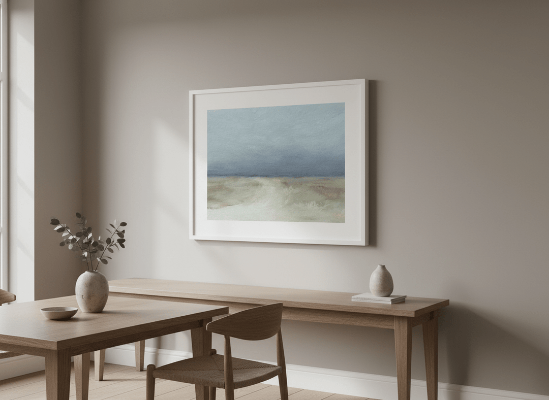 Wall art styled above a dining table in a contemporary home