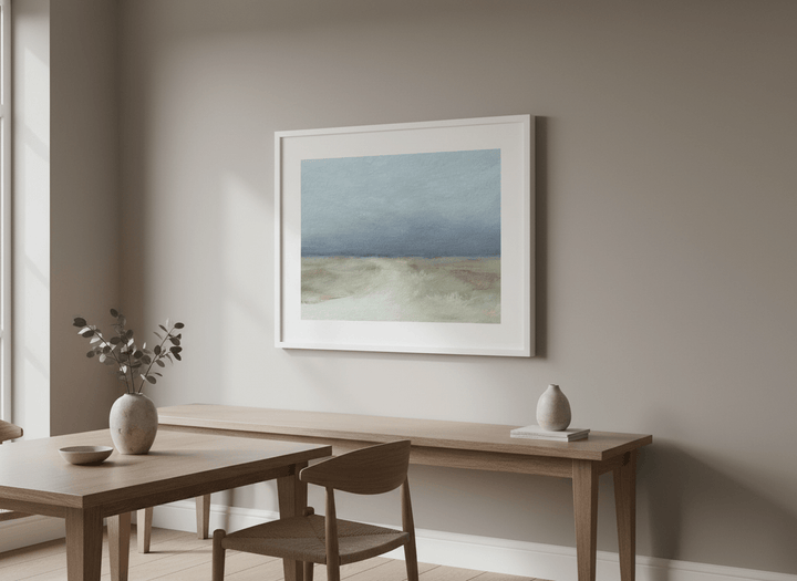 Wall art styled above a dining table in a contemporary home