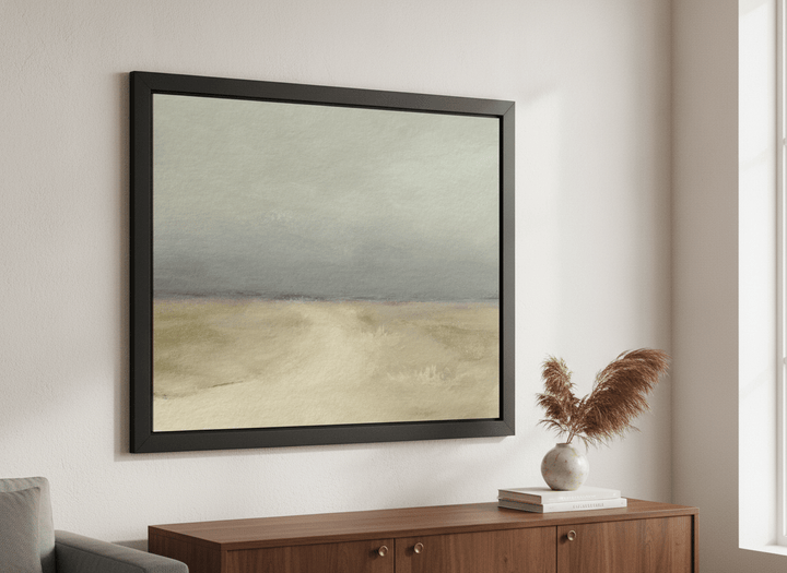 Modern wall art styled above a sofa in a neutral living room
