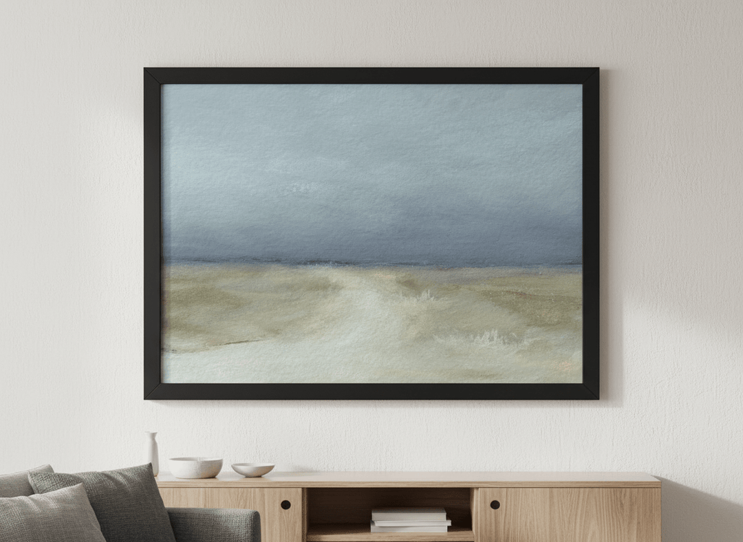 Modern wall art styled above a sofa in a neutral living room