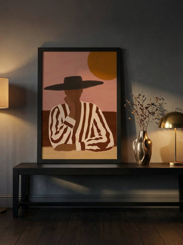 Modern wall art print standing on a console in a moody living room