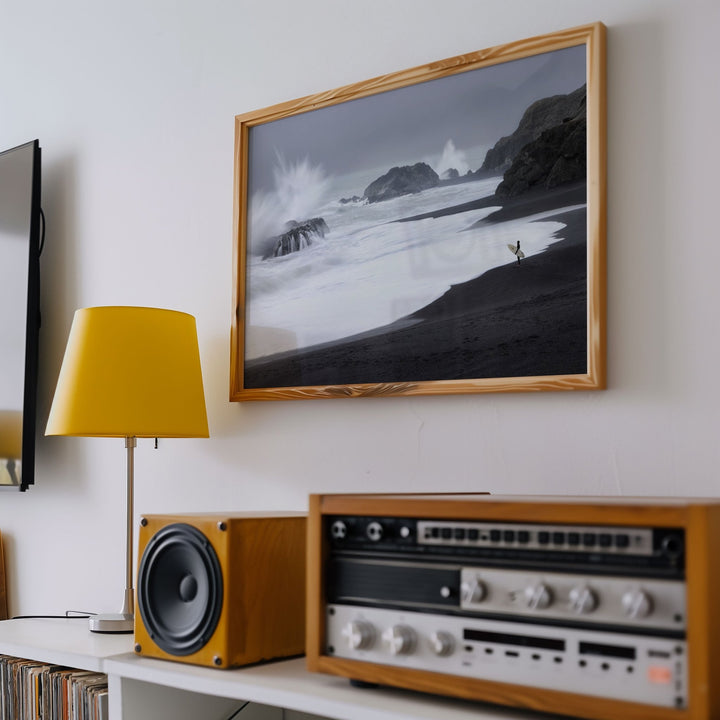 Room interior with a landscape picture, yellow lamp, and vintage stereo equipment.