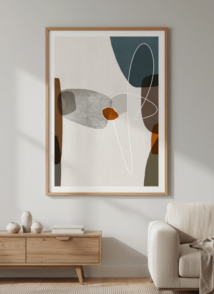 Modern wall art styled above a sofa in a neutral living room
